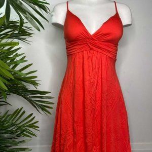 Coral spaghetti strap dress with a twist front